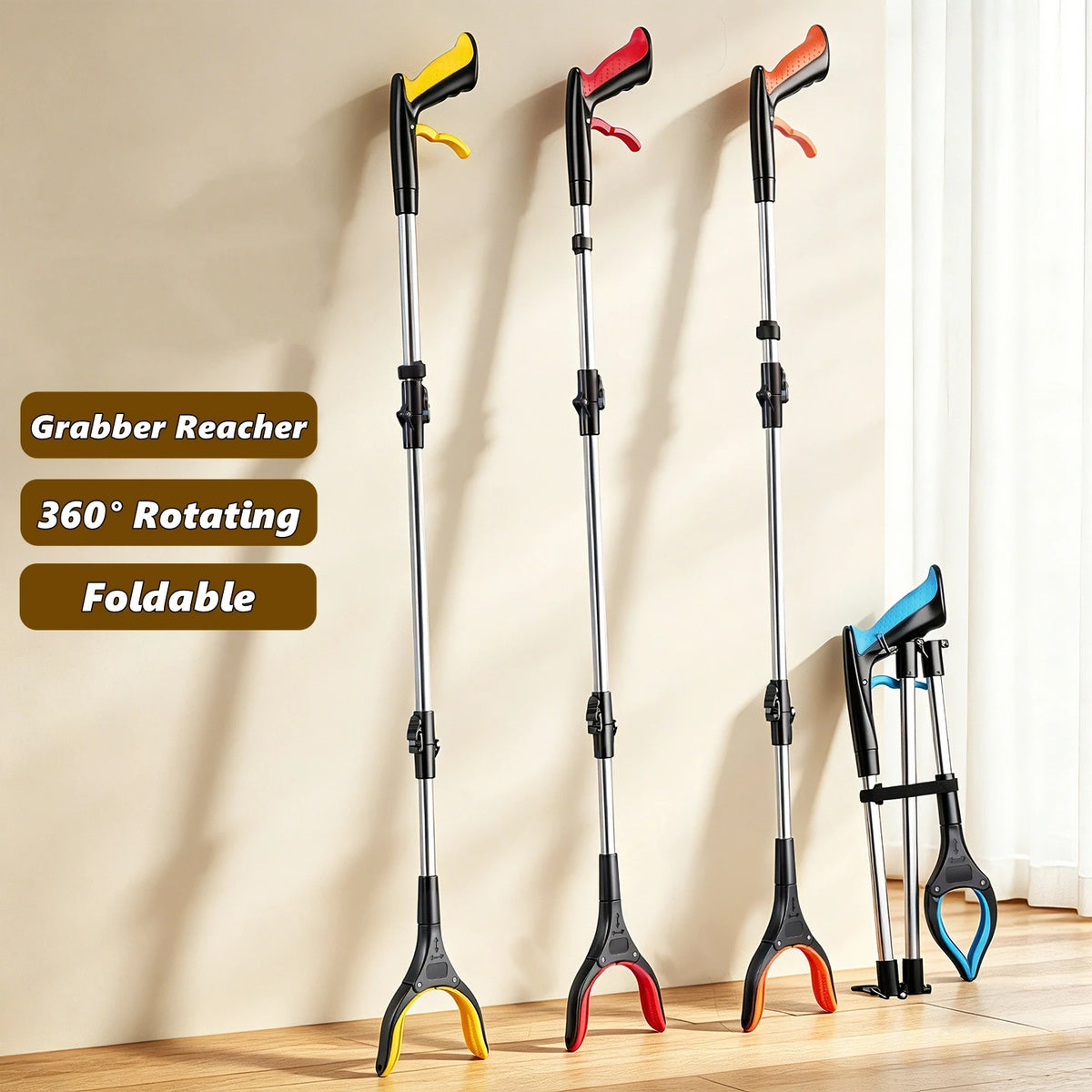 Three black grabber reachers with yellow and red tips are displayed against a light wall.