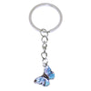 A silver hoop keychain charm featuring a colorful butterfly.