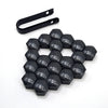 A set of 20 black hexagonal car wheel nut cap covers and a corresponding tool.