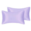 A set of two silky lavender satin pillowcases for hair and skin.