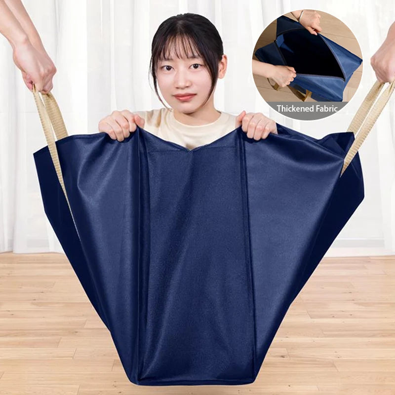 A person holds up a navy blue extra-large waterproof moving and storage bag made of thickened fabric.