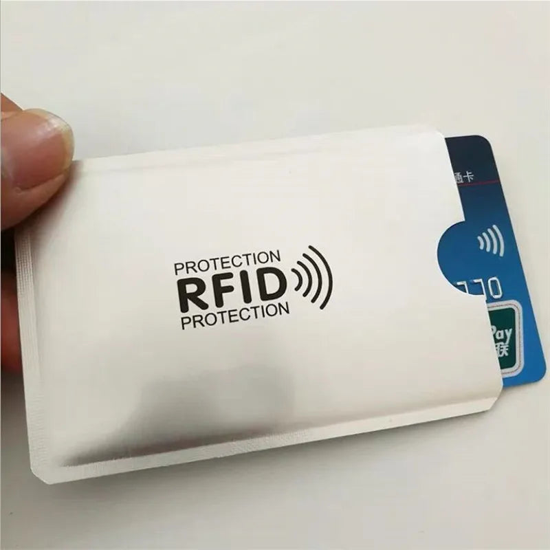 A white plastic card holder with an RFID protection symbol on it.