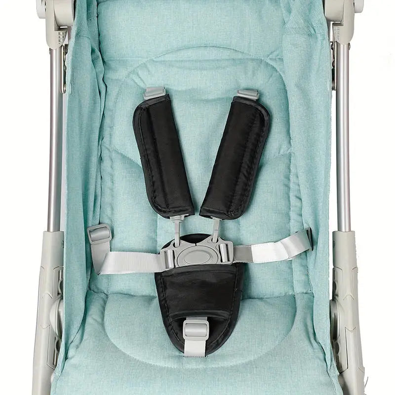 Light blue fabric cushion covers for a baby stroller and car seat belt