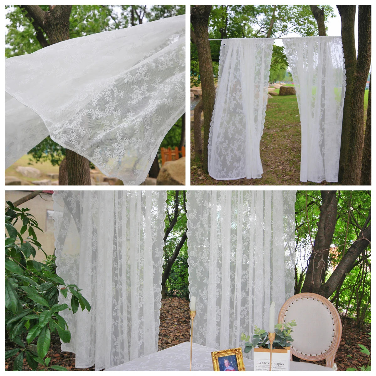 Two sheer white floral lace curtains hanging outdoors in a garden setting.