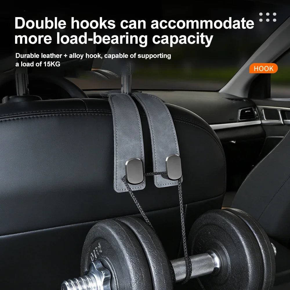 A close-up of a double hook car seat back with a suede finish used for hanging bags and accessories.