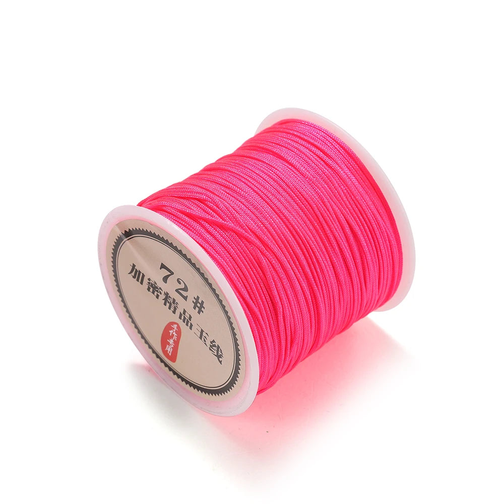 Spool of bright pink 0.8mm nylon macramé cord for jewelry making