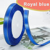 Roll of royal blue gold-edge satin ribbon for crafts and decor