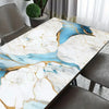 Marble contact paper featuring blue and gold veining on a table surface.