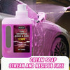 A pink bottle of Redecas car shampoo wash and wax is shown spraying foam onto a car surface.