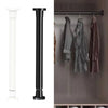 A black adjustable steel tension curtain rod with hanging clips mounted on a wall.