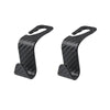 A pair of black carbon fiber headrest hooks used for storing bags, clothes, and other items.