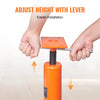Hands adjusting the height of an orange steel floor jack using a lever for easier installation.