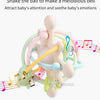 A silicone sensory rattle ball with colorful rings and musical notes, designed to soothe a baby's emotions.