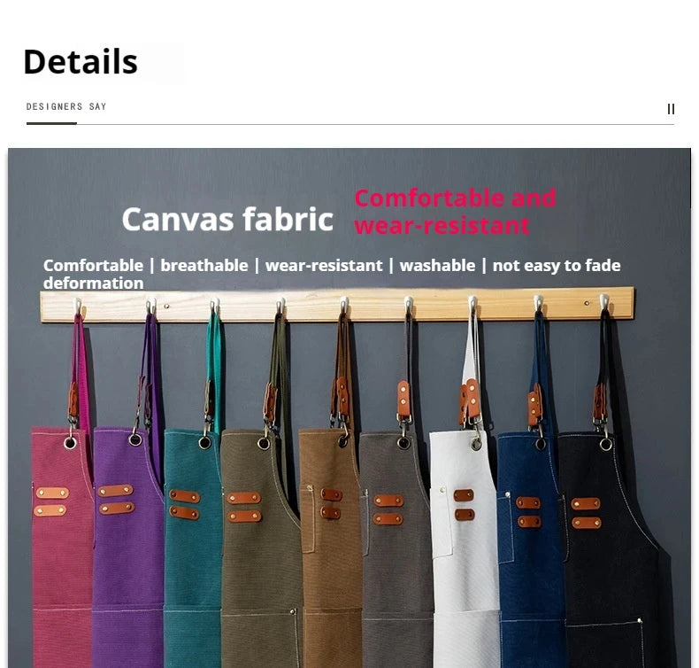 A row of professional chef aprons in various colors hanging on a wooden rack.