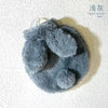 A gray plush rabbit hot water bottle with a soft flannel cover.