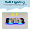 A smartphone displaying various icons and illuminated with blue light, used for soft lighting.