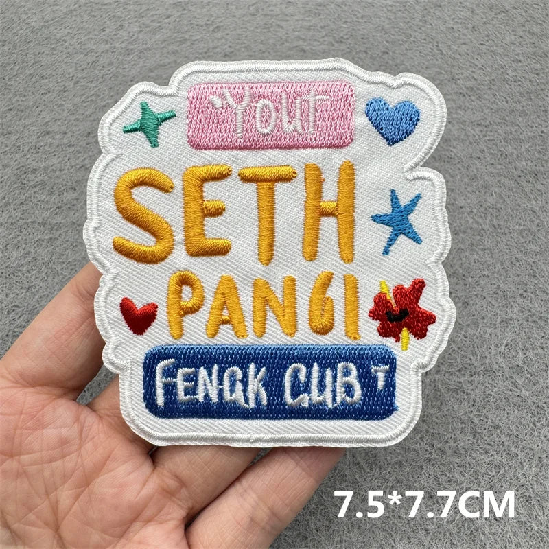 A set of embroidered iron-on patches featuring the name Seth Pangsi and the text Feng Cub on a white fabric background.