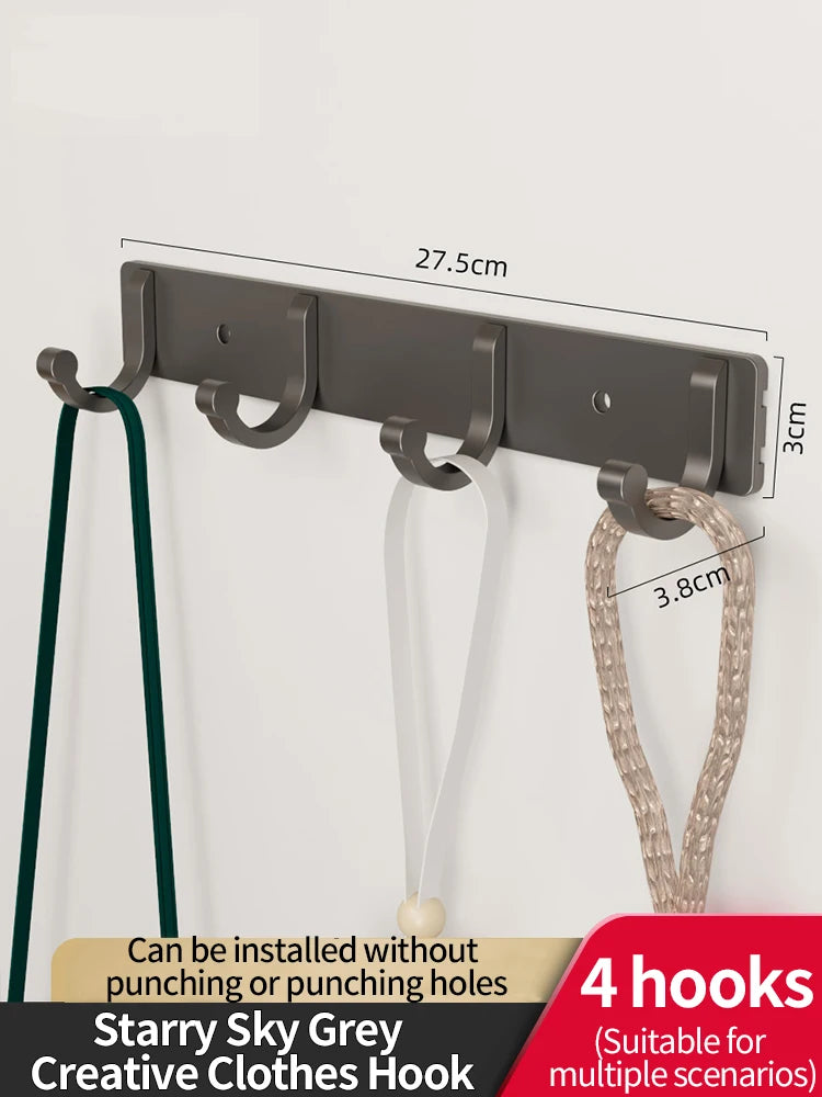 A set of four grey wall hooks with adhesive backing and a hanger shown against a white background.