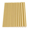 A row of polished brass bar rods used for wire and tube making.