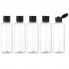 Five clear glass refillable travel bottles with flip caps arranged in a row.