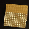A deck of luxury gold foil playing cards with a matte finish shown against a dark background.
