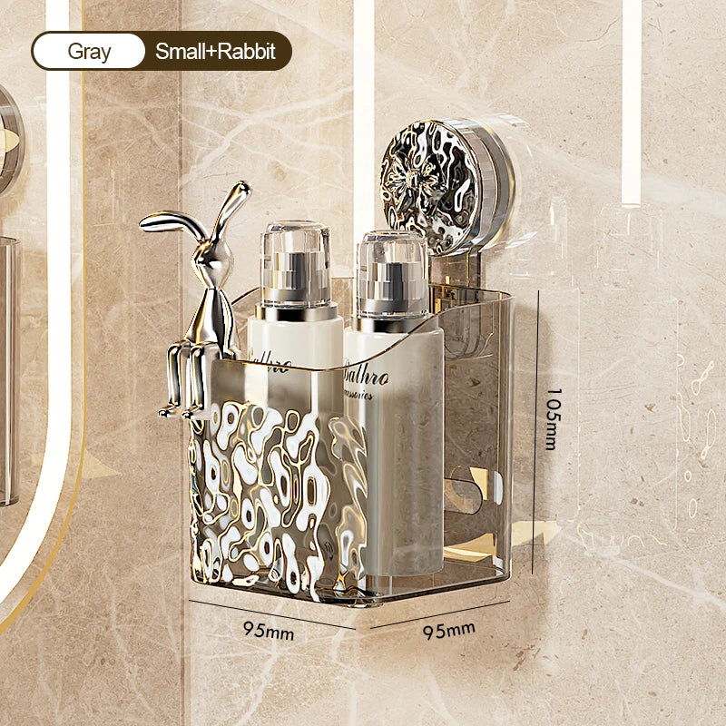 A wall-mounted storage basket with a silver finish and water ripple design holds two glass bottles and a metal figurine.
