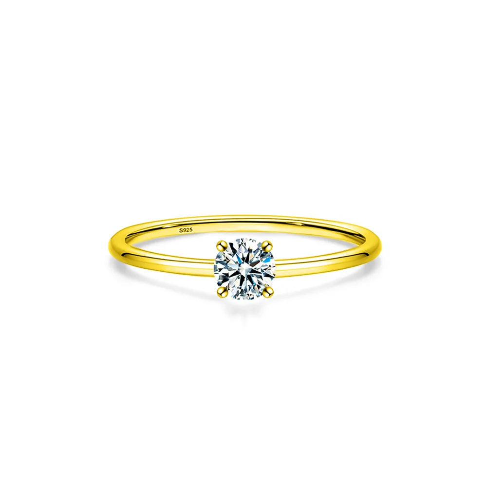 A minimalist moissanite solitaire ring set in sterling silver with a round brilliant stone.
