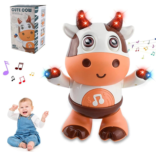 Un lindo juguete de vaca de peluche con cuernos y luces brillantes, junto a su empaque y un bebé.