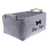 A gray felt storage basket with handles is shown, labeled Dog Toys.