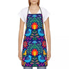 A woman wearing a vibrant purple and green Mexican floral art apron over a white shirt.