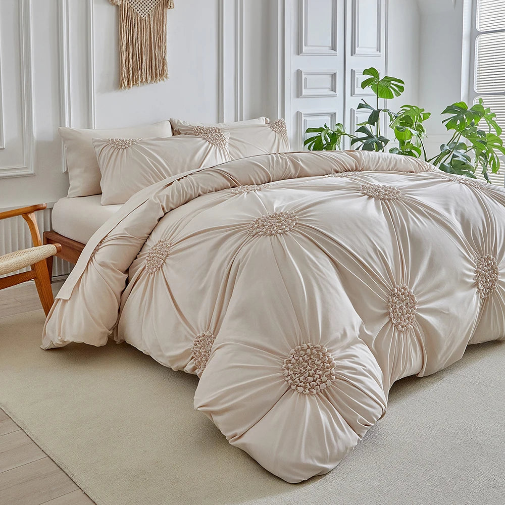 A beige three-dimensional pleated floral duvet cover set displayed on a bed in a bright room.