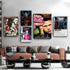 A collection of movie posters featuring the Fight Club theme displayed on a white wall above a brown sofa.