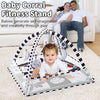A baby corral fitness stand featuring a play gym mat with hanging toys for self-imagination and creativity.
