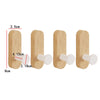Four natural wood hooks with white adhesive grips for entryway and bathroom organization.