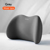 A grey memory foam car headrest and lumbar support pillow shown on a white surface.