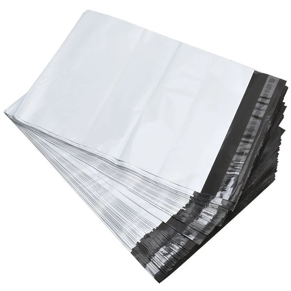 A stack of white poly mailers with self-sealing strips, showing the clear plastic and black sealing strip edge.