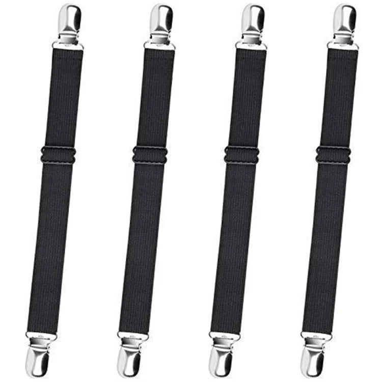 A set of four black adjustable elastic bed sheet corner straps with silver metal ends.