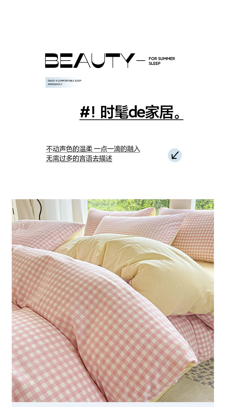 Close-up of a pink and white checkered duvet cover set with two pillows on a bed.