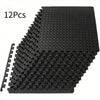A stack of 12 interlocking black EVA foam exercise mats.
