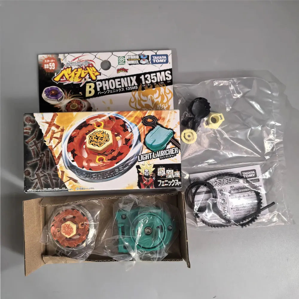A set of three metal spinning tops, including a box and packaged items, for a battle game.