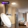 A motion sensor ceiling light is installed above kitchen cabinets in a modern interior setting.