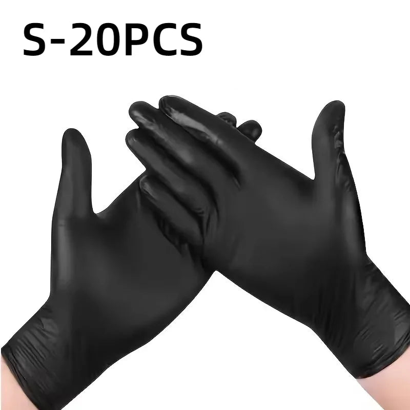 A pair of black disposable nitrile gloves are shown, folded or overlapped.