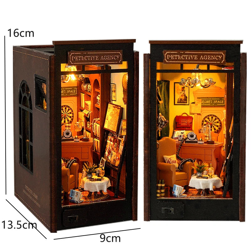 A wooden book nook kit featuring a detective agency scene with LED lighting and miniature furniture.