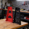 Red and black heavy-duty ABS wrench organizer trays with multi-slot storage racks on a wooden workbench