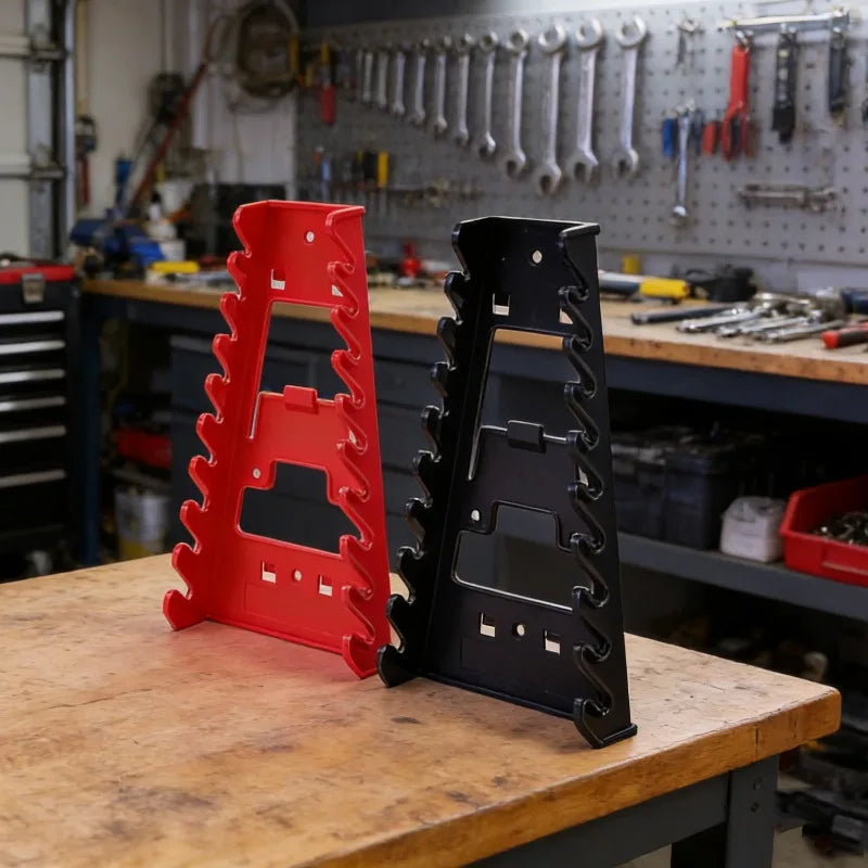 Red and black heavy-duty ABS wrench organizer trays with multi-slot storage racks on a wooden workbench