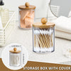 Clear acrylic storage box with bamboo lid filled with toothbrushes and other bathroom items