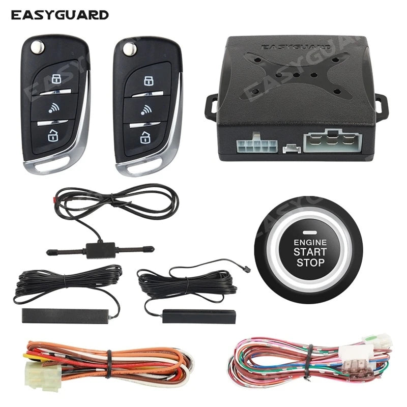 A set of keyless entry components including a remote, a push button, and various wiring harnesses for an ignition system.