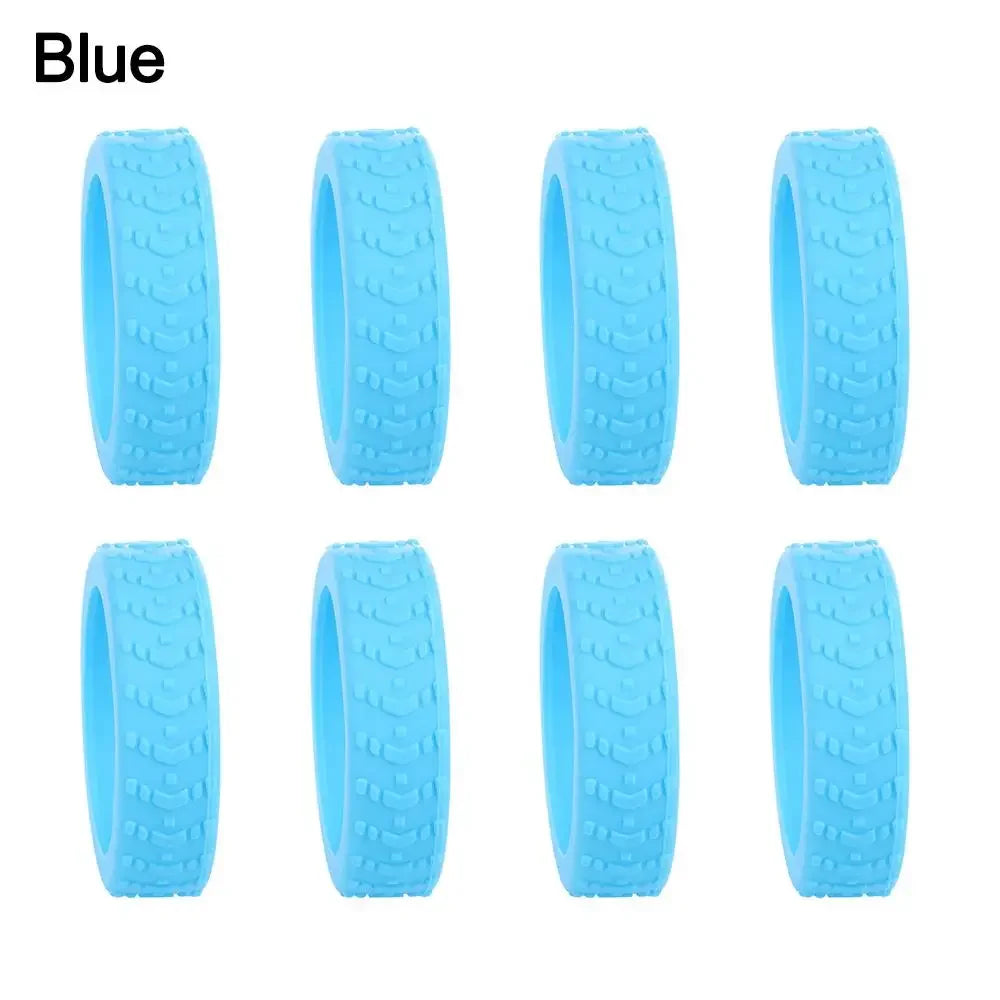 A set of blue silicone luggage wheel protectors designed to prevent scratching and reduce noise during travel.