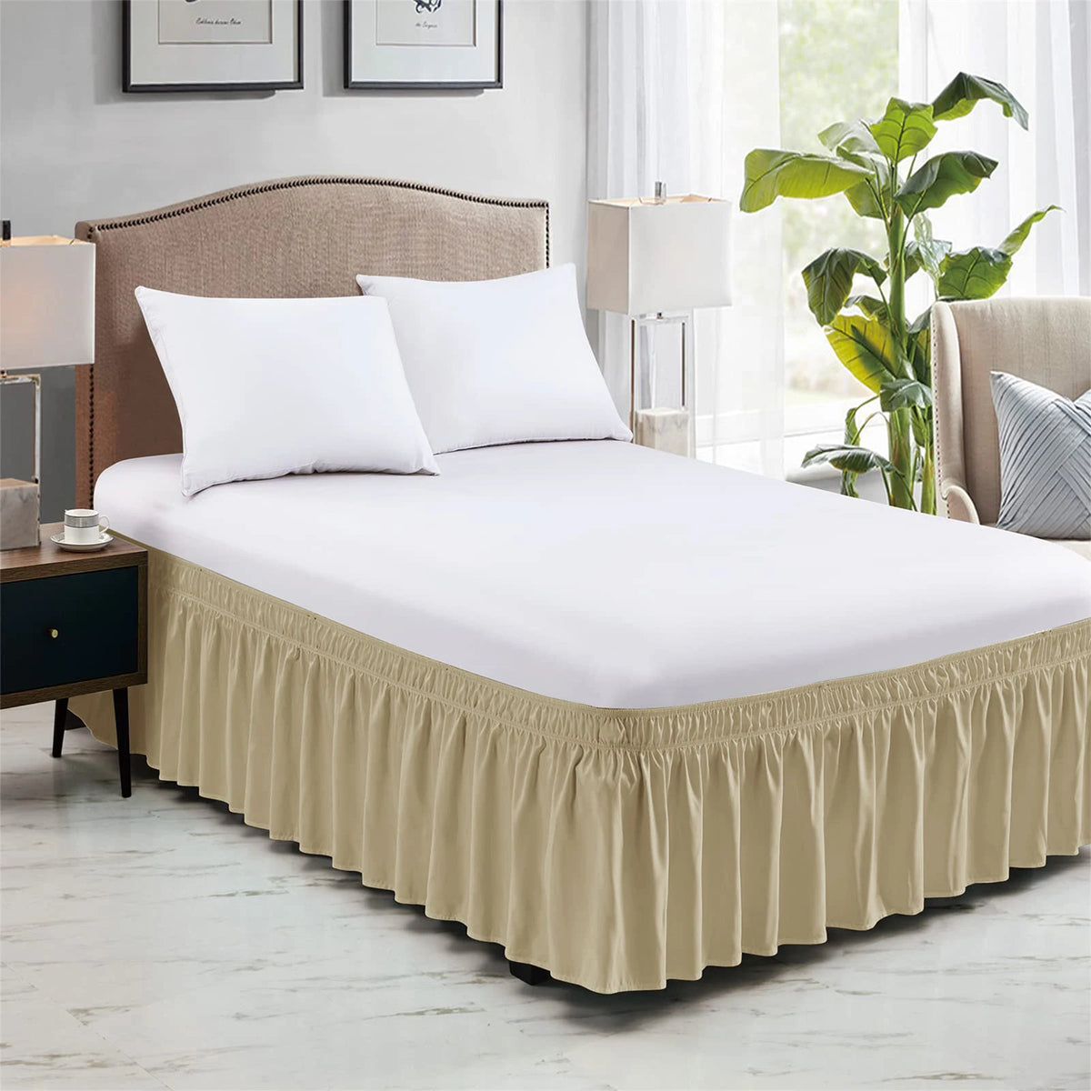 A white bed with a beige elastic wrap-around skirt featuring ruffles, set in a light-colored bedroom.