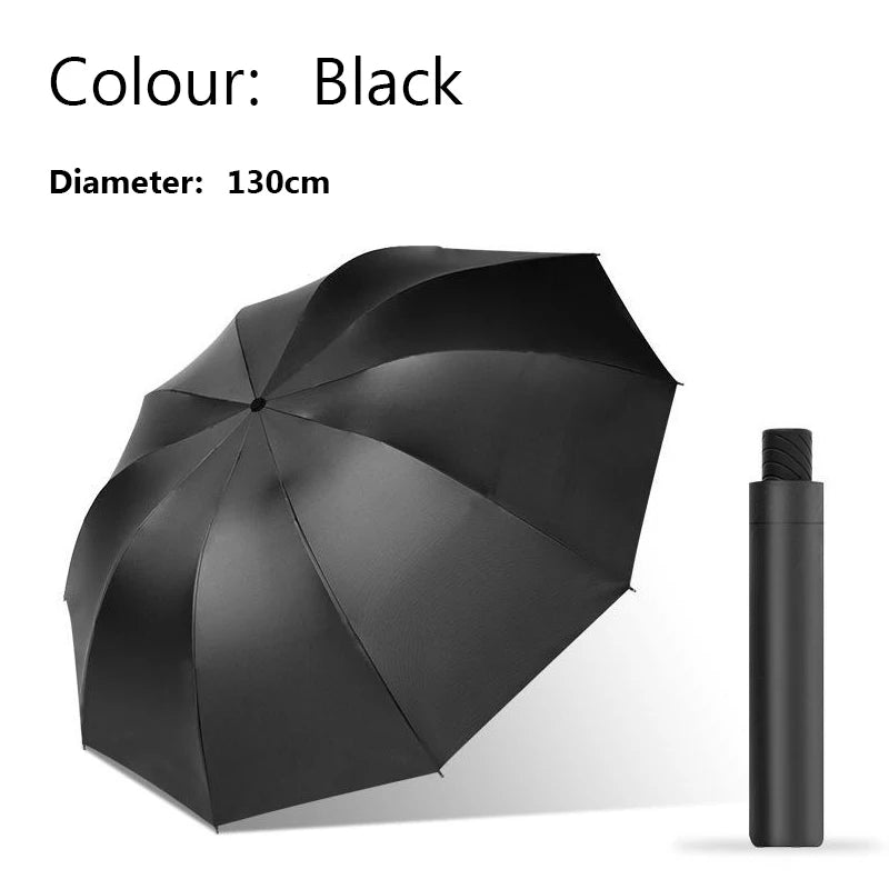 Black extra-large windproof folding umbrella with a 130cm diameter shown in a closed view.